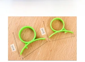 Detailed view of green plastic kitchen peeler dimensions with ring handle measurements