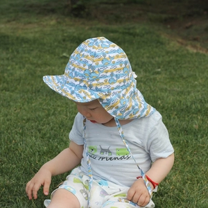 Kids sun hat with neck protection flap, whale print design, and adjustable chin strap