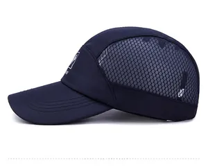 Detail view of the breathable grey honeycomb mesh and side logo on navy baseball cap