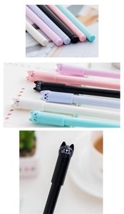 Detail of five cute cartoon cat gel pens in pink, purple, black, white, and sky blue colors