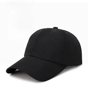 Detail of black mesh baseball cap showing breathable texture and curved brim for summer sports