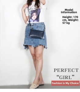Navy blue leather envelope bag on 170cm model showing slim design and crossbody fit