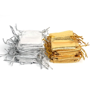 Metallic gold and silver drawstring jewelry gift pouches with a glossy finish