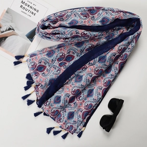 Detail of paisley print cotton linen scarf with wooden beads and tassel accents