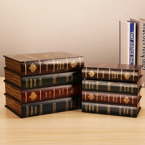 Set of eight vintage decorative book boxes in brown and green with gold lettering