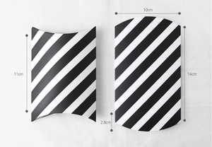 Macro view of black and white striped pillow boxes with precise size measurements