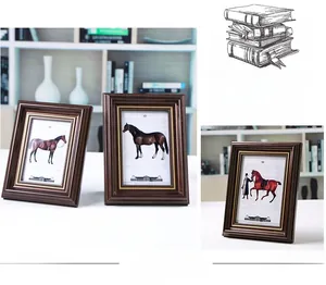 Macro shot of retro dark brown wood frame with elegant gold beaded inner trim