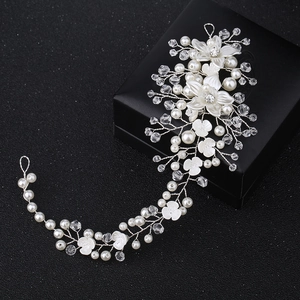 Handmade bridal headband with white flowers, pearls, and crystals on silver wire