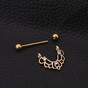 Detailed view of 316L gold stainless steel nipple ring with three zircon stones