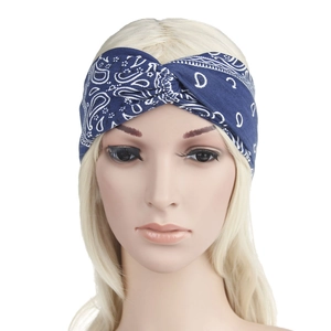 Close-up of blue paisley print twist knot headband on display model for women