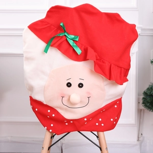 Christmas Santa Claus chair cover in red and white fabric with 3D nose and green bow