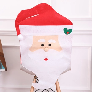 Santa Claus chair cover in red and white fabric for festive Christmas table decoration
