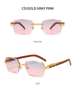 Macro detail of rimless sunglasses with gold leopard metal emblem and wood texture arms
