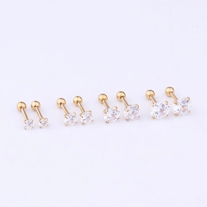 Detailed set of four gold stainless steel stud earrings with round cubic zirconia stones