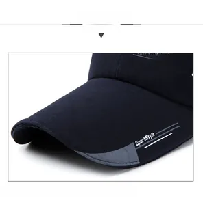 Detailed close-up of navy sports cap brim with white SportStyle printing and striped fabric
