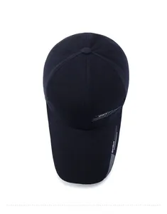 Top view of navy blue cotton baseball cap with sports fashion line text on brim