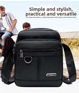 Close-up of waterproof Oxford fabric texture and metal D-ring buckle on black crossbody bag