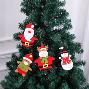 Detail of Christmas tree ornaments featuring Santa, reindeer, bear, and snowman hanging felt