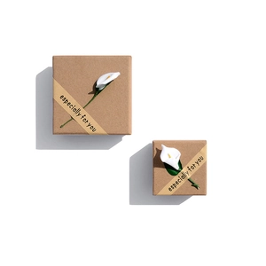 Elegant wood-color jewelry gift boxes with white flowers and decorative ribbons