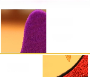 Close-up of purple felt fabric and red sequins on the Halloween pumpkin hair clip