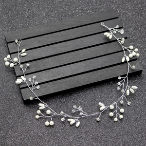 Detailed macro view of 1.5M bridal hair vine with handmade pearls and crystals