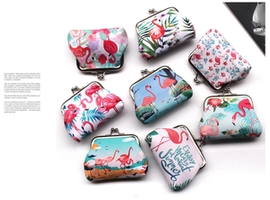 Detailed view of flamingo print coin purses with vintage metal clasp and summer slogan