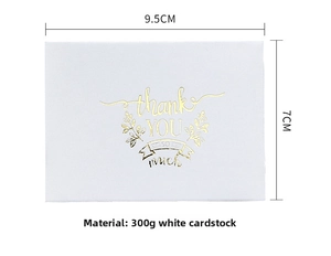 Macro detail of white 300g cardstock thank you card with gold foil lettering and 9.5x7cm size