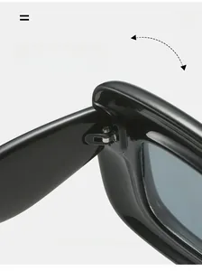 Close-up of durable metal hinge on black Y2K sunglasses with industrial texture