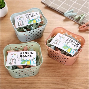 30-piece windproof plastic clothes peg set with storage basket in pastel colors