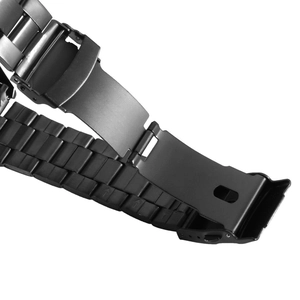 Macro shot of the black stainless steel folding clasp on a mechanical watch strap
