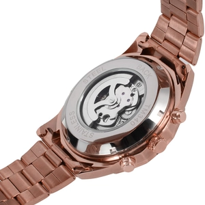 Detailed macro view of the skeleton automatic watch back showing movement and stainless steel