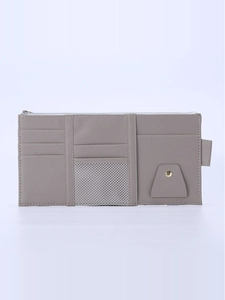 Close-up of grey PU leather car sun visor organizer with card slots and mesh pocket