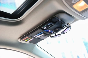 Car sun visor organizer made of black PU leather with multiple card slots and glasses clip