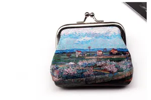 Close-up of vintage kiss-lock coin purse with impressionist oil painting floral print