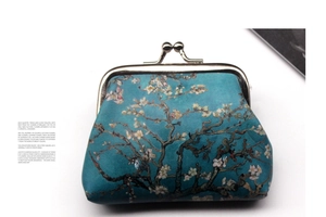 Macro detail of vintage clasp purse featuring Van Gogh Almond Blossom art print