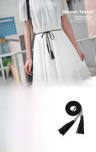 Close-up detail of black braided PU leather waist chain belt with tassel and metal buckle