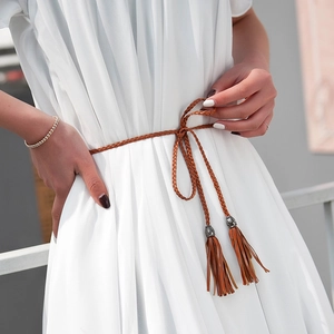 Brown braided PU leather thin waist belt with tassel detail on white dress for women