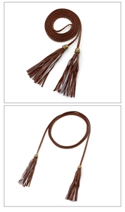 Detail of brown PU braided waist chain with long tassels and antique bronze buckle