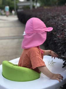 Detailed back view of pink kids sun hat featuring a wide brim and full neck protection flap