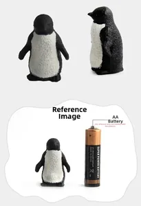 Detailed realistic penguin figurine model showing fine feather texture with size comparison