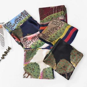Macro shot of satin silk squares featuring pastoral landscapes and elegant rolled edges