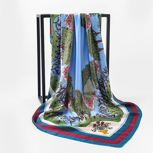 Artistic landscape floral silk satin square scarf displayed on minimalist metal frame