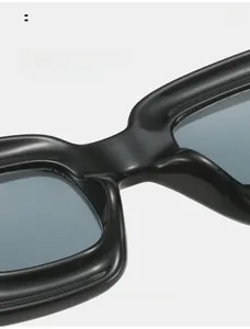 Detail view of comfortable integrated nose pads on black Y2K chunky rectangle sunglasses