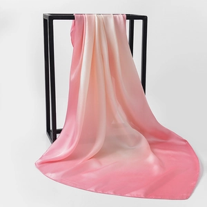 Detail of elegant gradient pink silk scarf with satin luster and smooth drape texture