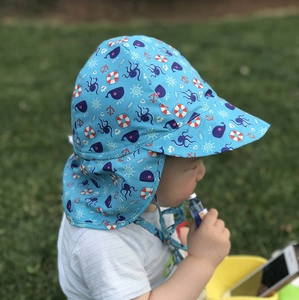 Detail of blue sun hat with ocean prints and extended neck protection for toddlers