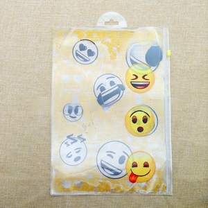 Close-up of clear PVC zipper pencil case featuring colorful emoji prints and secure top seal