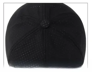 Macro detail of breathable black mesh baseball cap crown and reinforced stitching