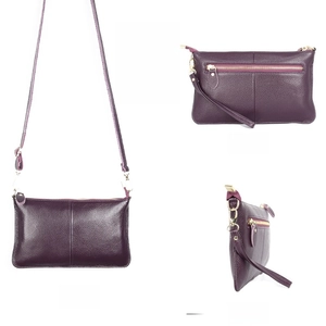 Detailed views of a purple pebbled leather envelope bag with gold hardware and back zipper