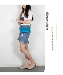 Blue leather slim envelope crossbody bag with vertical stitching and gold hardware buckle