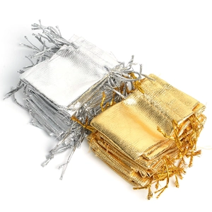 Bulk gold and silver drawstring jewelry pouches with metallic gloss fabric texture